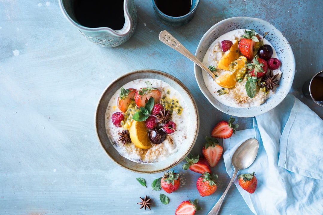 Bowls of oatmeal topped with fresh fruit for digestive wellness
