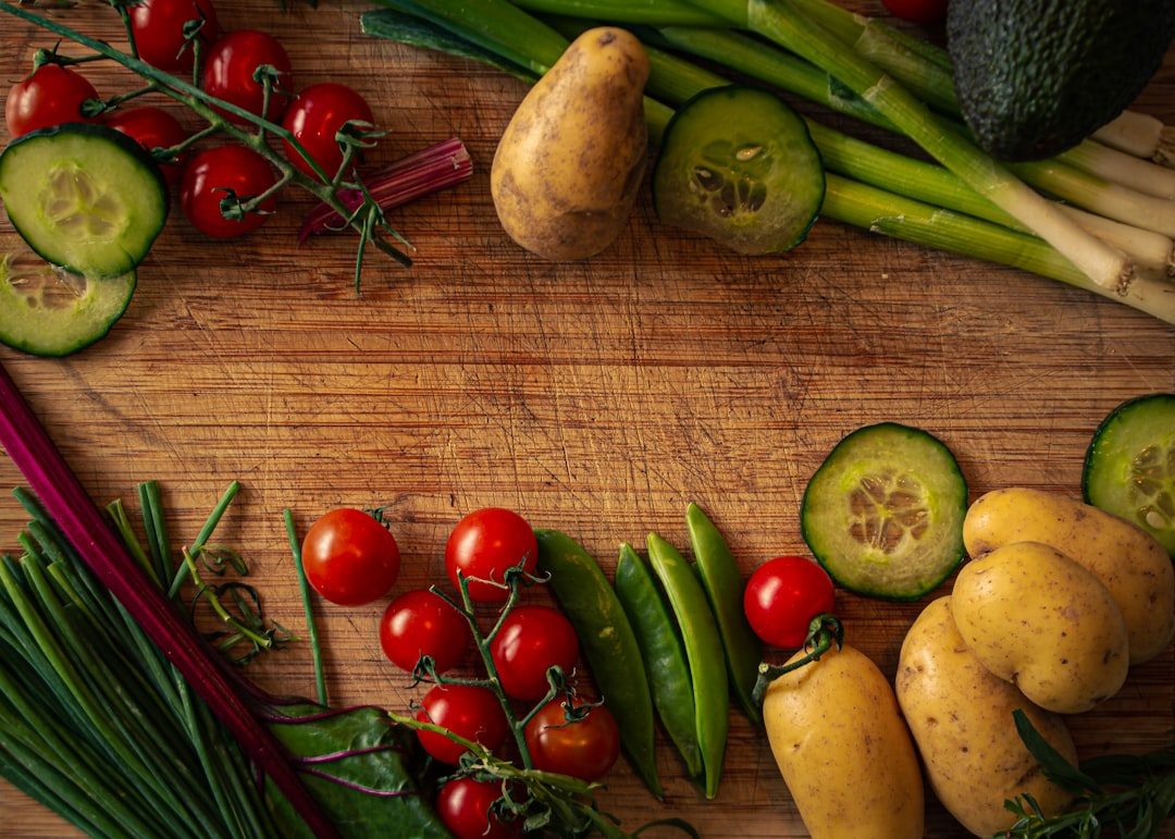 A colorful spread of fresh vegetables and ingredients on a cutting board
